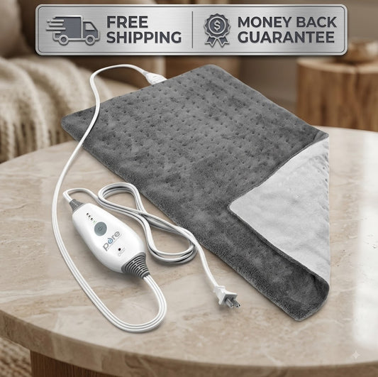 A gray heated blanket with a white power cord and control module, displayed on a light wood table. A promotional banner at the top reads 'FREE SHIPPING' and 'MONEY BACK GUARANTEE'.
