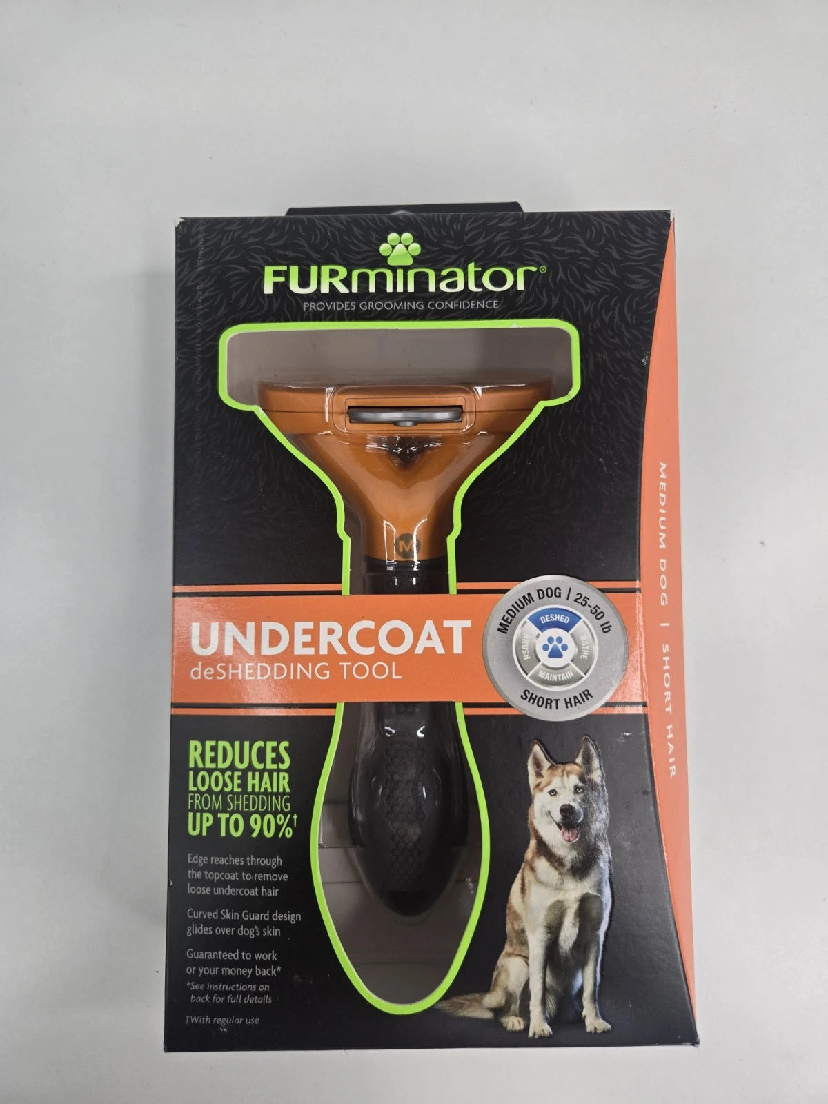 FURminator stainless steel deShedding tool for medium dogs, designed to remove loose undercoat hair